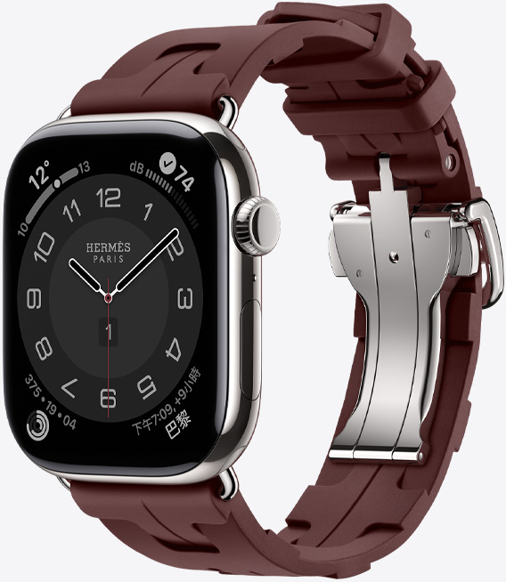 Apple Watch Hermès Series 11，展示銀色鈦金屬錶殼，搭配 Bordeaux 酒紅色 Kilim 錶帶，以及可快速拆卸的銀色金屬錶釦