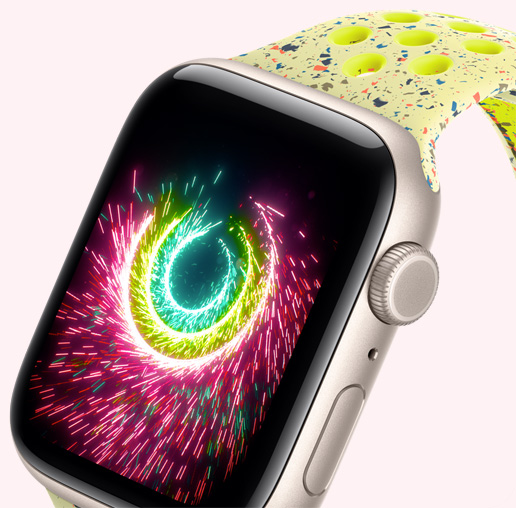 Apple Watch SE 3, Aluminiumgehäuse, Farbe Polarstern, Aktivitäts­ringe sprühen wie Feuerwerk, Nike Sport Loop in Volt Splash