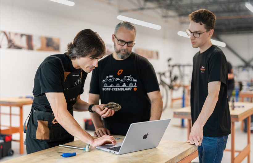 Nicolas Paquin, a Bicycles Quilicot trainer, uses MacBook&nbsp;Pro to access materials for the company’s free bicycle mechanic certification programme.
